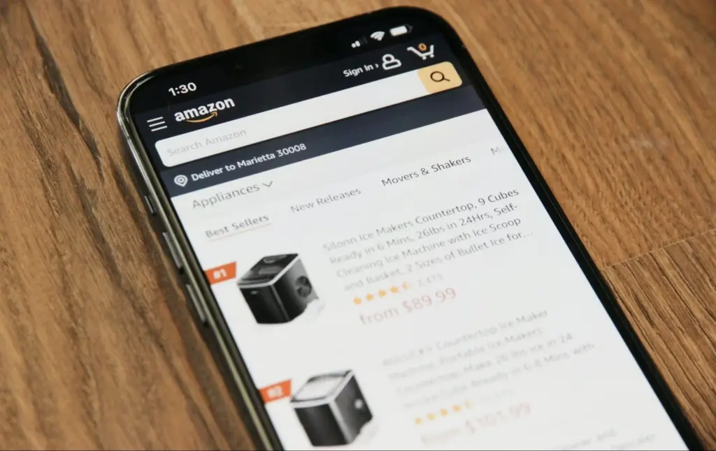 A cellphone with the Amazon app open displaying individual products. 