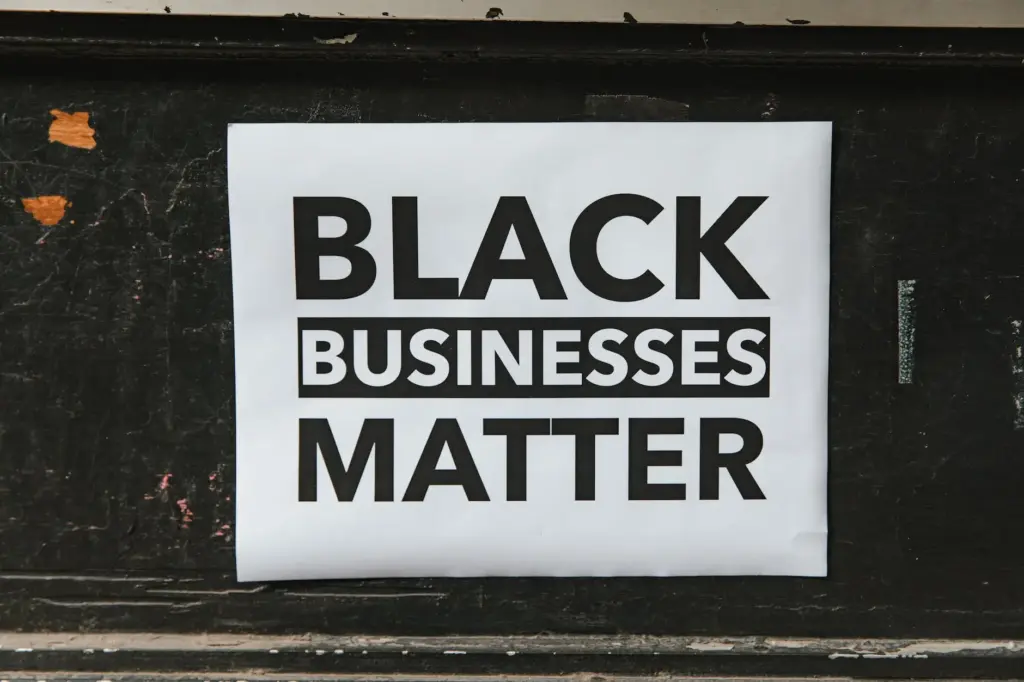 Black businesses matter poster hanging on a wall.