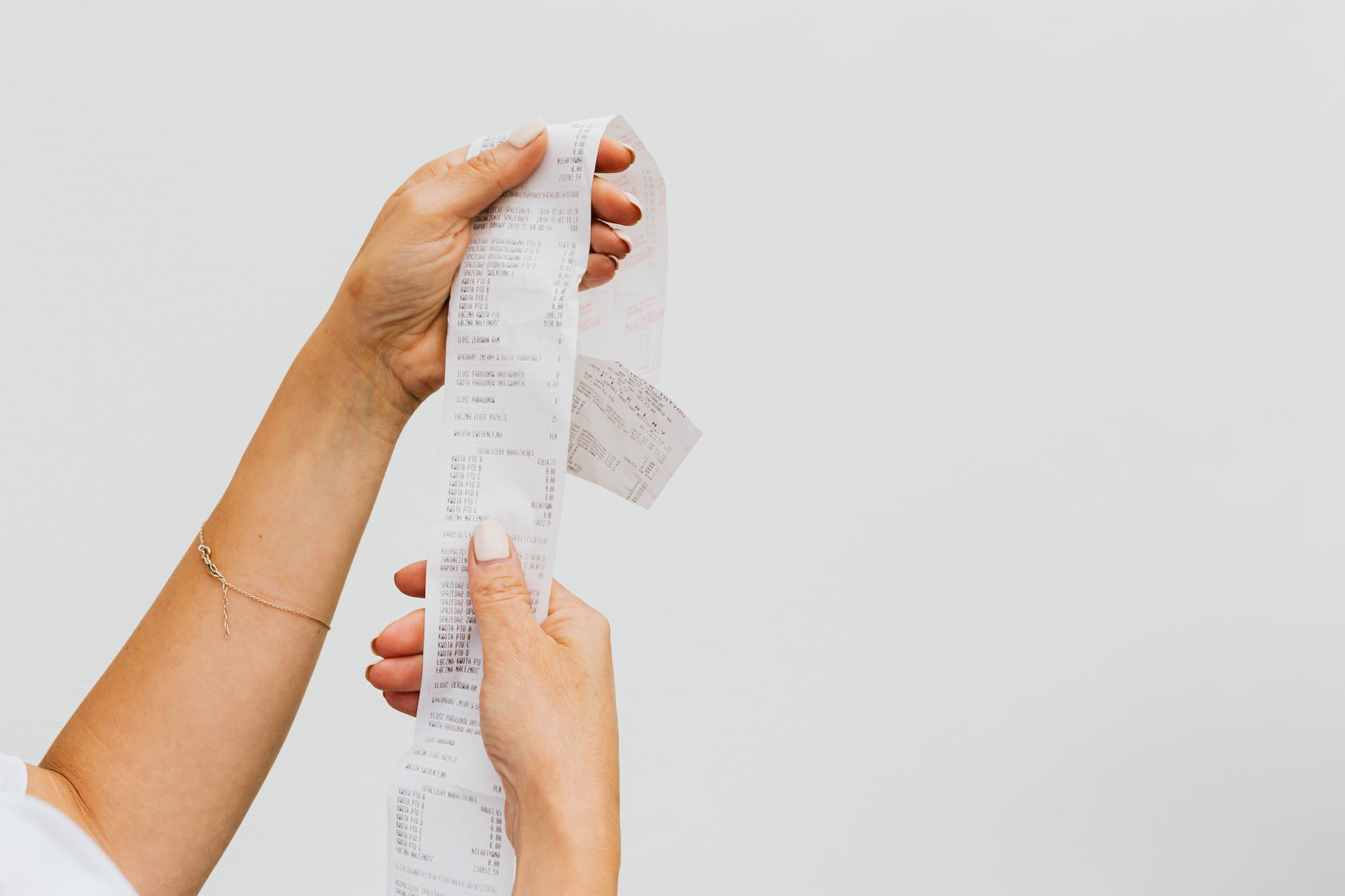 woman holding a receipt