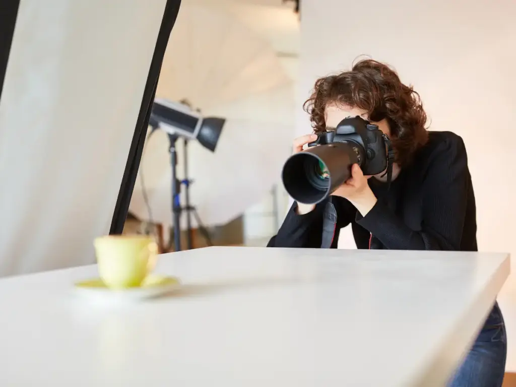 A photographer taking pictures of a product.